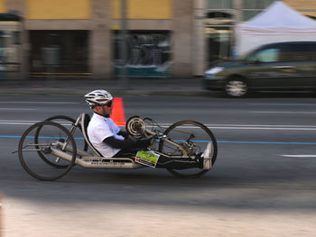 Man riding bicycle on motorcycle