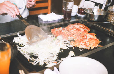 Close-up of person preparing food