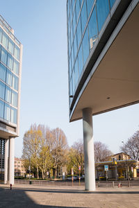 View of bridge and buildings against clear sky