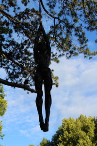 Low angle view of statue against sky