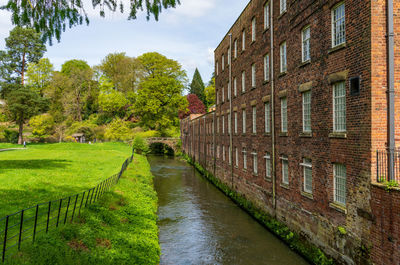 Footpath amidst buildings in city