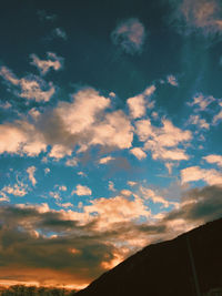 Low angle view of silhouette mountain against sky during sunset