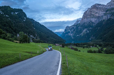 Campervan in landscape at klöntalersee, glarus, switzerland