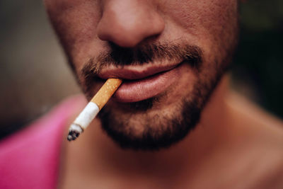 Close-up of man smoking cigarette