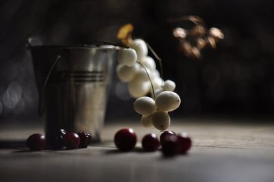 Close-up of fruits in glass jar on table