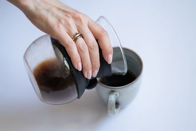 Midsection of woman holding drink