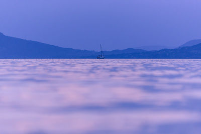 Scenic view of sea against blue sky