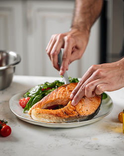 Midsection of man preparing food