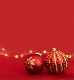 Close-up of christmas decorations against yellow background