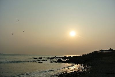 Scenic view of sea at sunset