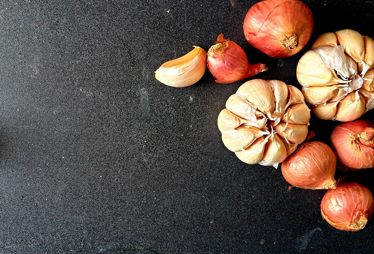 food and drink, food, freshness, healthy eating, wellbeing, still life, high angle view, produce, flower, vegetable, plant, no people, ingredient, directly above, garlic, indoors, onion, spice, pumpkin, still life photography, raw food, orange color, table, close-up, fruit, garlic bulb, shallot