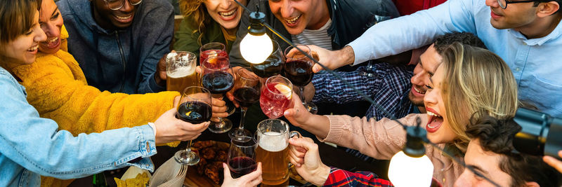 Group of people toasting wineglasses for sale