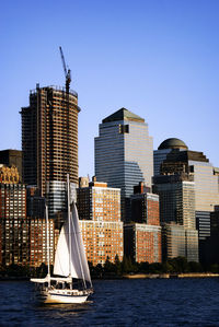 Modern buildings in city against clear sky