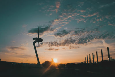 Low angle view of street light against sky during sunset