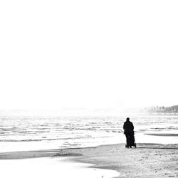 Woman standing on shore