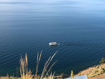 High angle view of sailboats sailing on sea