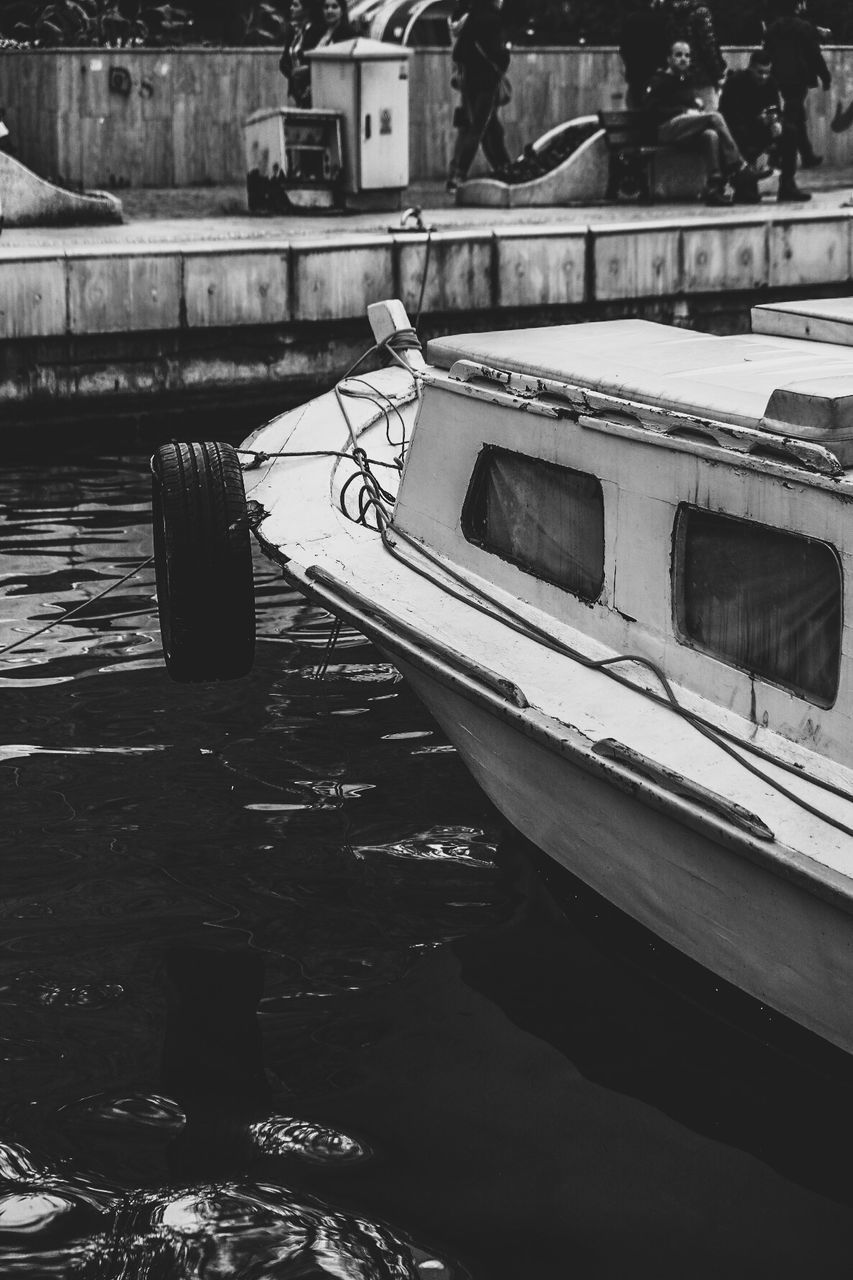 BOATS MOORED IN HARBOR