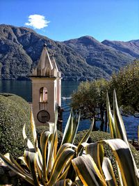 Tower bell against mountain range