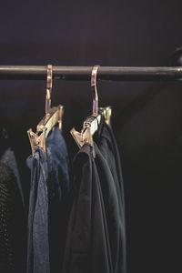 Close-up of clothes hanging on rack