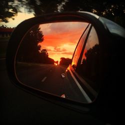 Close-up of side-view mirror of car