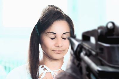 Beautiful young woman looking down