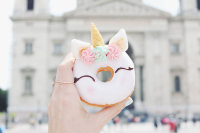 Close-up of hand holding ice cream