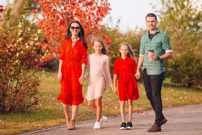 Full length portrait of a smiling young couple