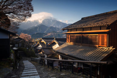 View of houses on snowcapped mountain