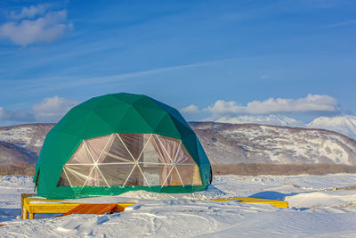 Winter glamping on the pacific ocean near volcanoes