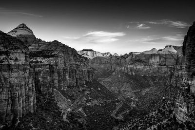 View of landscape with mountain range in background