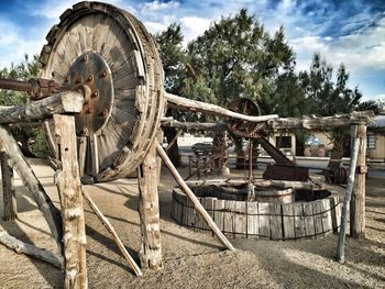 An old well on a field against the sky 