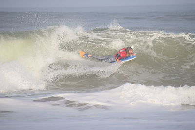 Man surfing in sea