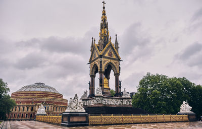 The prince albert memorial in kensington gardens with royal albert hall in background