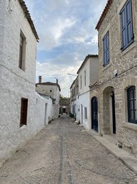 Empty alley amidst buildings in town stone houses