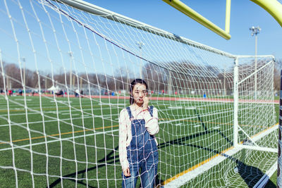 Young woman on soccer field