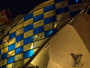 Low angle view of modern building at night