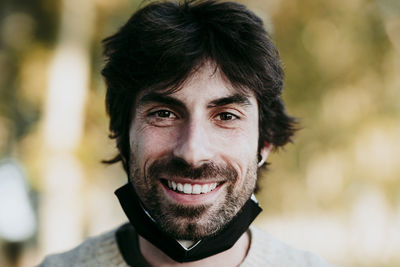 Close-up portrait of smiling young man