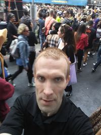 Portrait of people on street in city
