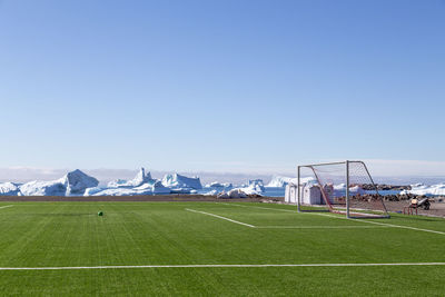 Scenic view of field against clear sky