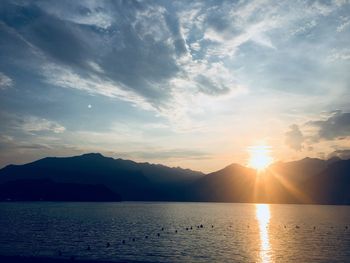 Scenic view of lake against sky during sunset