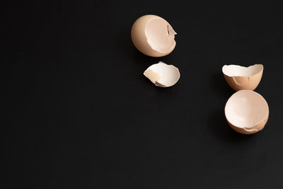 Close-up of crystal ball on table against black background