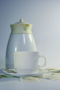 Close-up of coffee cup on table