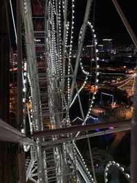 Low angle view of illuminated bridge at night