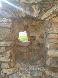 Low angle view of stone wall