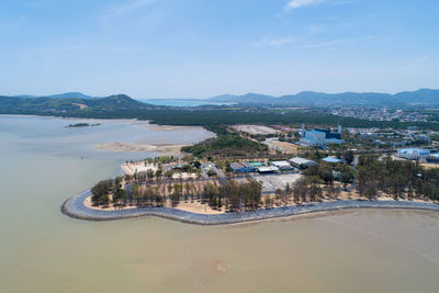 High angle view of sea and buildings against sky