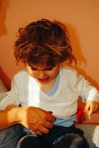 Girl sitting with mother at home