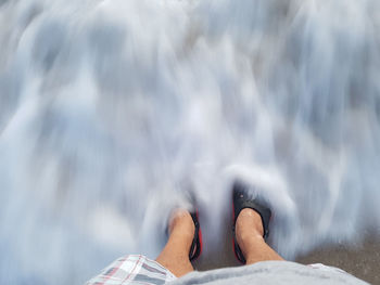 Low section of person lying on ground