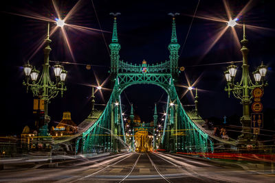 Illuminated suspension bridge at night