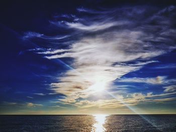 Low angle view of sea against sky during sunset