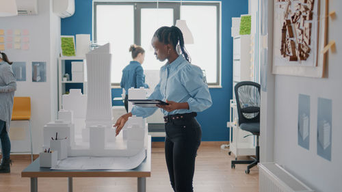 Side view of man working in office